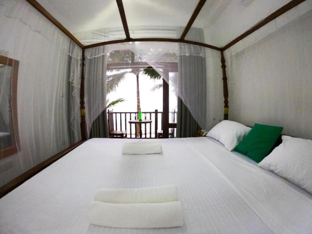 Asa Bay Beach Resort Talpe Exterior photo
